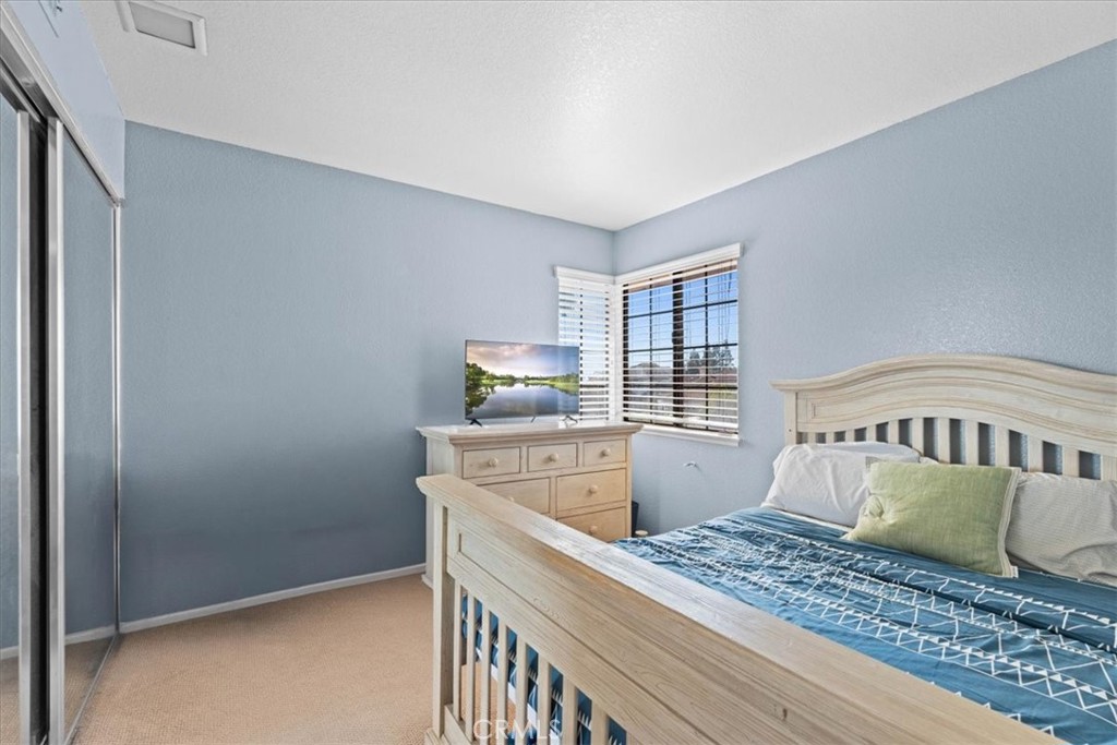 10536 Deerfield Drive Rancho Cucamonga, CA 91701 - Photo 20 of 28 a bedroom with a bed and a window