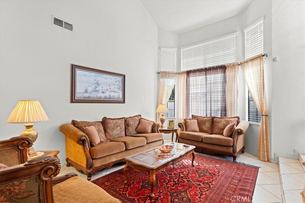 10536 Deerfield Drive Rancho Cucamonga, CA 91701 - Photo 4 of 28 a living room with furniture and a window