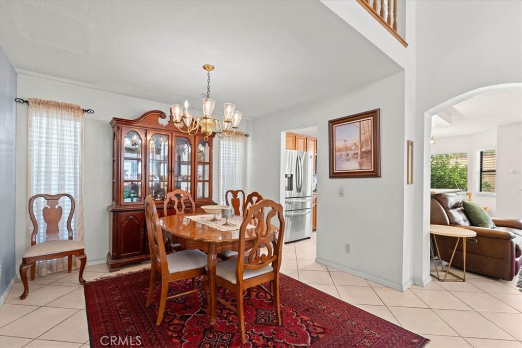10536 Deerfield Drive Rancho Cucamonga, CA 91701 - Photo 5 of 28 a view of a dining room with furniture and chandelier