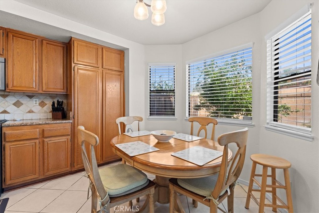 10536 Deerfield Drive Rancho Cucamonga, CA 91701 - Photo 8 of 28 a dining room with furniture and window