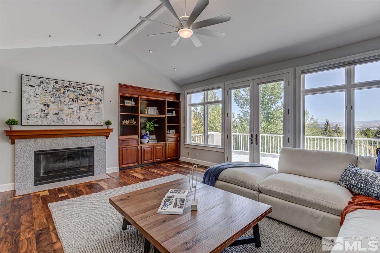 25 Promontory Pointe Reno, NV 89519 - Photo 14 of 40 a living room with furniture a window and a fireplace