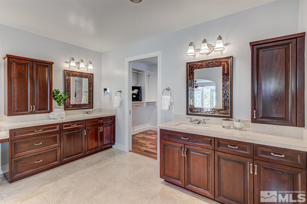 25 Promontory Pointe Reno, NV 89519 - Photo 20 of 40 a spacious bathroom with double vanity and mirrors
