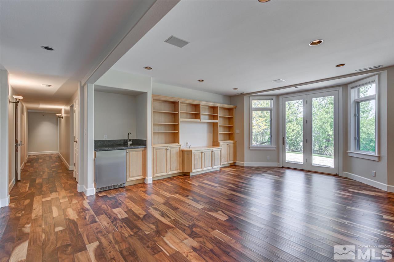 25 Promontory Pointe Reno, NV 89519 - Photo 22 of 40 a view of empty room with wooden floor and fan