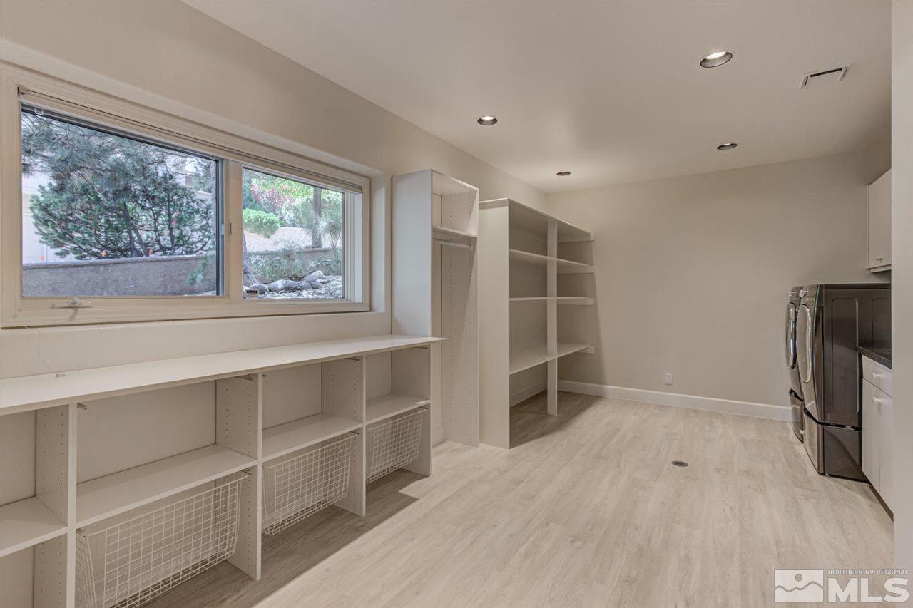 25 Promontory Pointe Reno, NV 89519 - Photo 31 of 40 a view of an empty room with a window and a kitchen