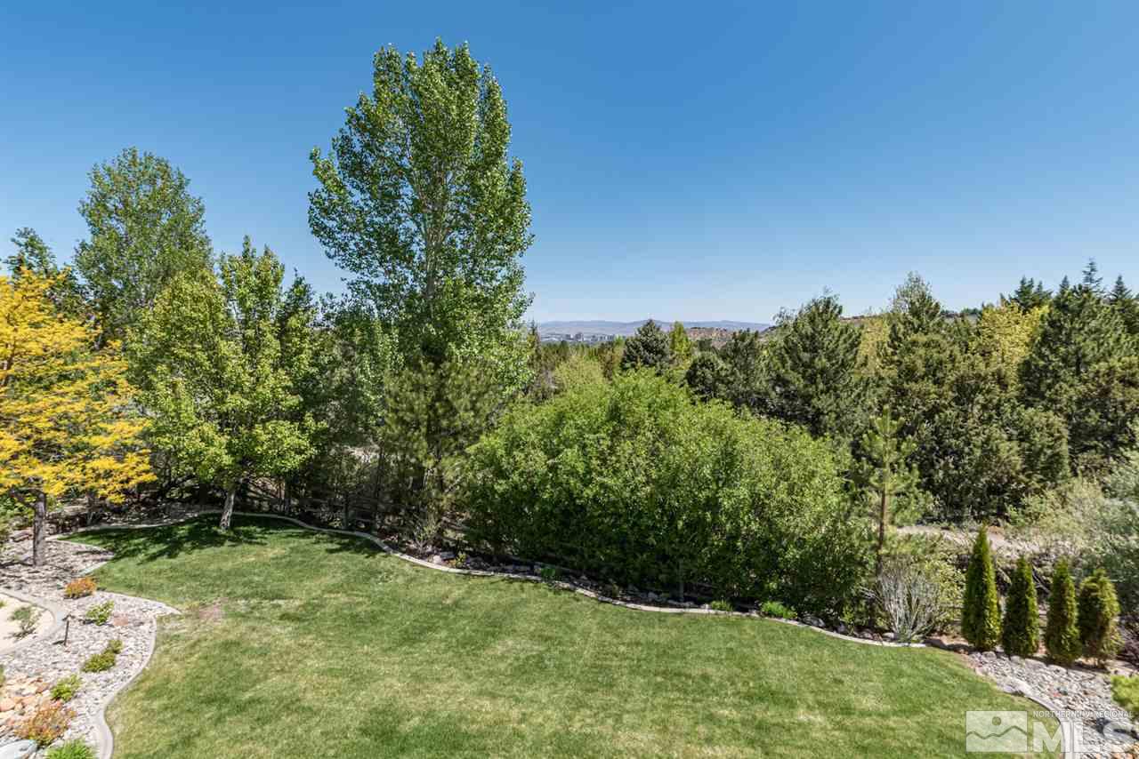 25 Promontory Pointe Reno, NV 89519 - Photo 36 of 40 a backyard of a house with lots of green space