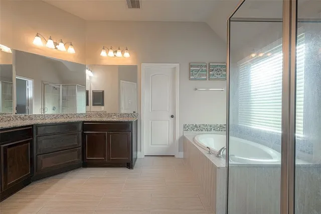 a view of a house with backyard and garden