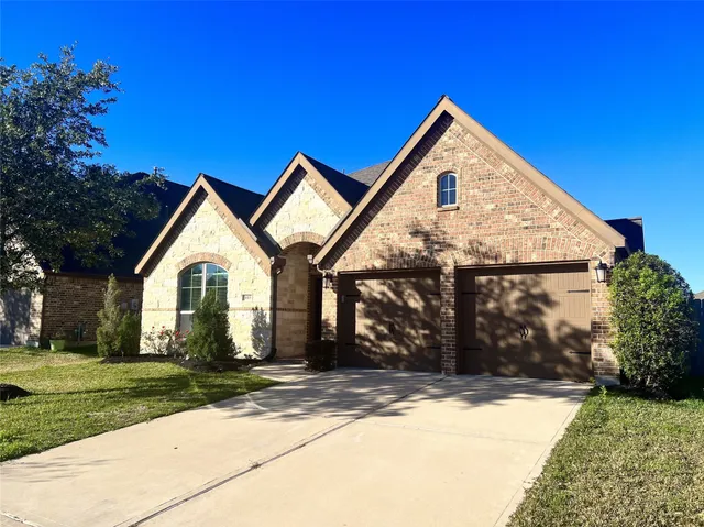 a front view of a house with yard