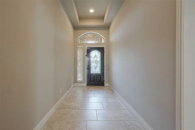 a view of a livingroom with wooden floor and a window