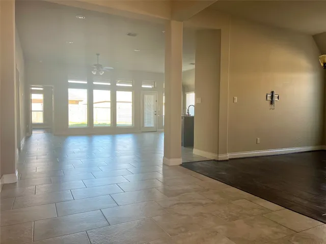 a kitchen with kitchen island granite countertop a stove and a sink