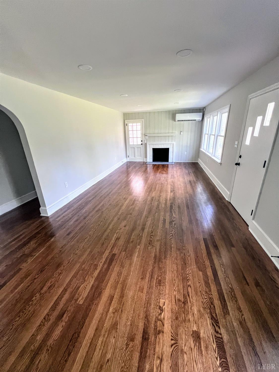 198 Woodbridge Lane Spout Spring, VA 24593 - Photo 9 of 27 a view of empty room with wooden floor and fan
