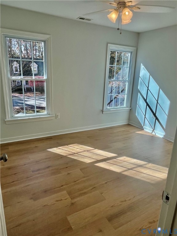 5617 Chatmoss Road Midlothian, VA 23112 - Photo 18 of 23 a view of an empty room with window and wooden floor