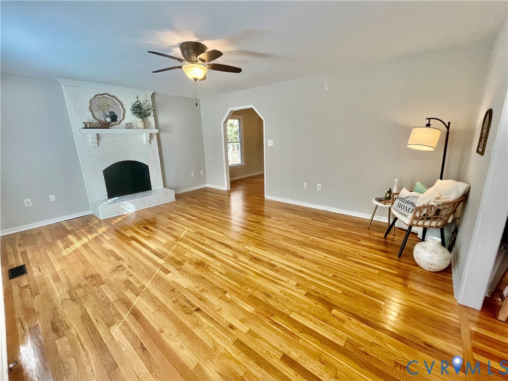 5617 Chatmoss Road Midlothian, VA 23112 - Photo 3 of 23 a living room with furniture and a fireplace
