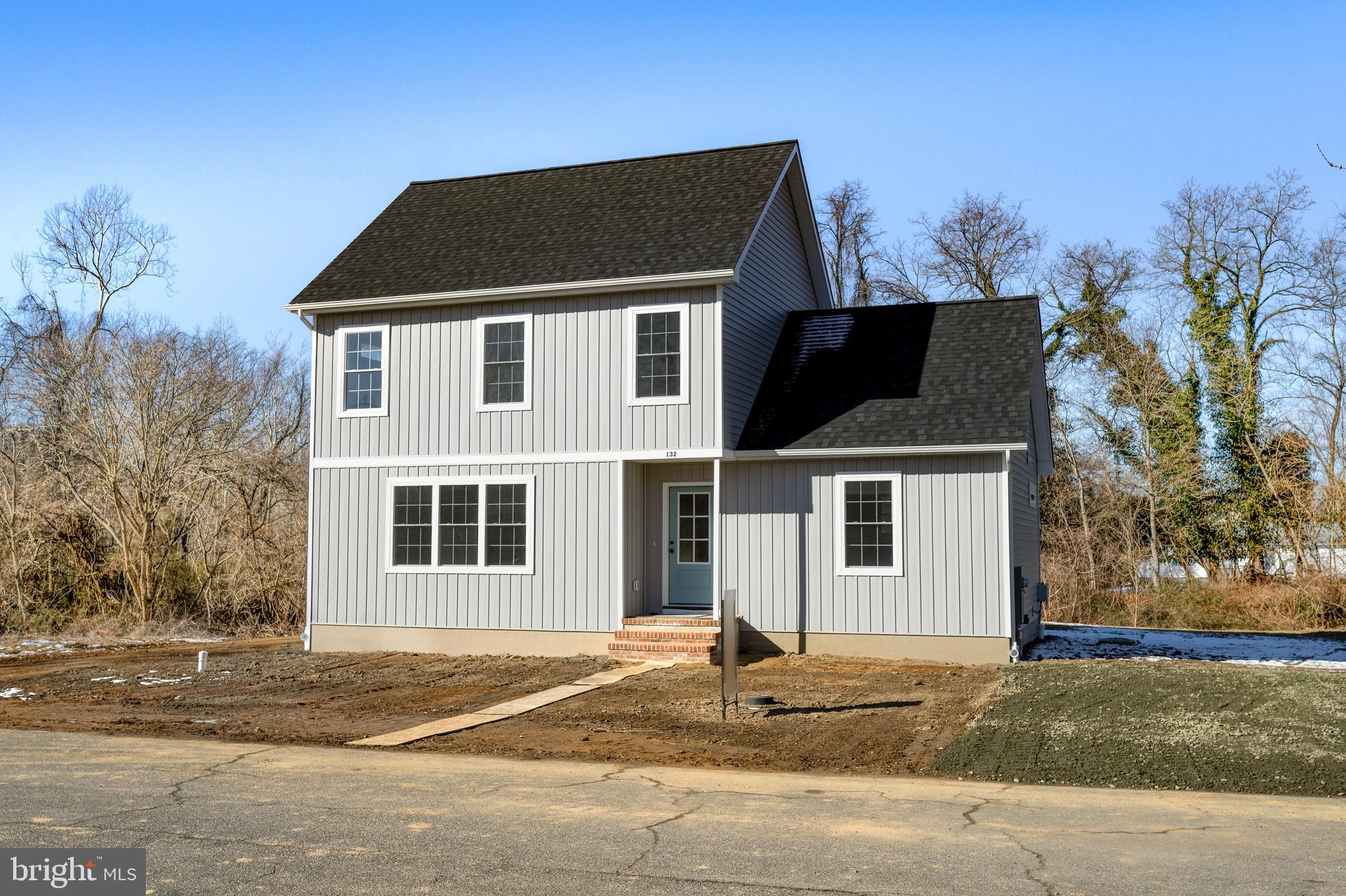 132 Spring Street Centreville, MD 21617 - Photo 1 of 19 a front view of a house with a yard and garage