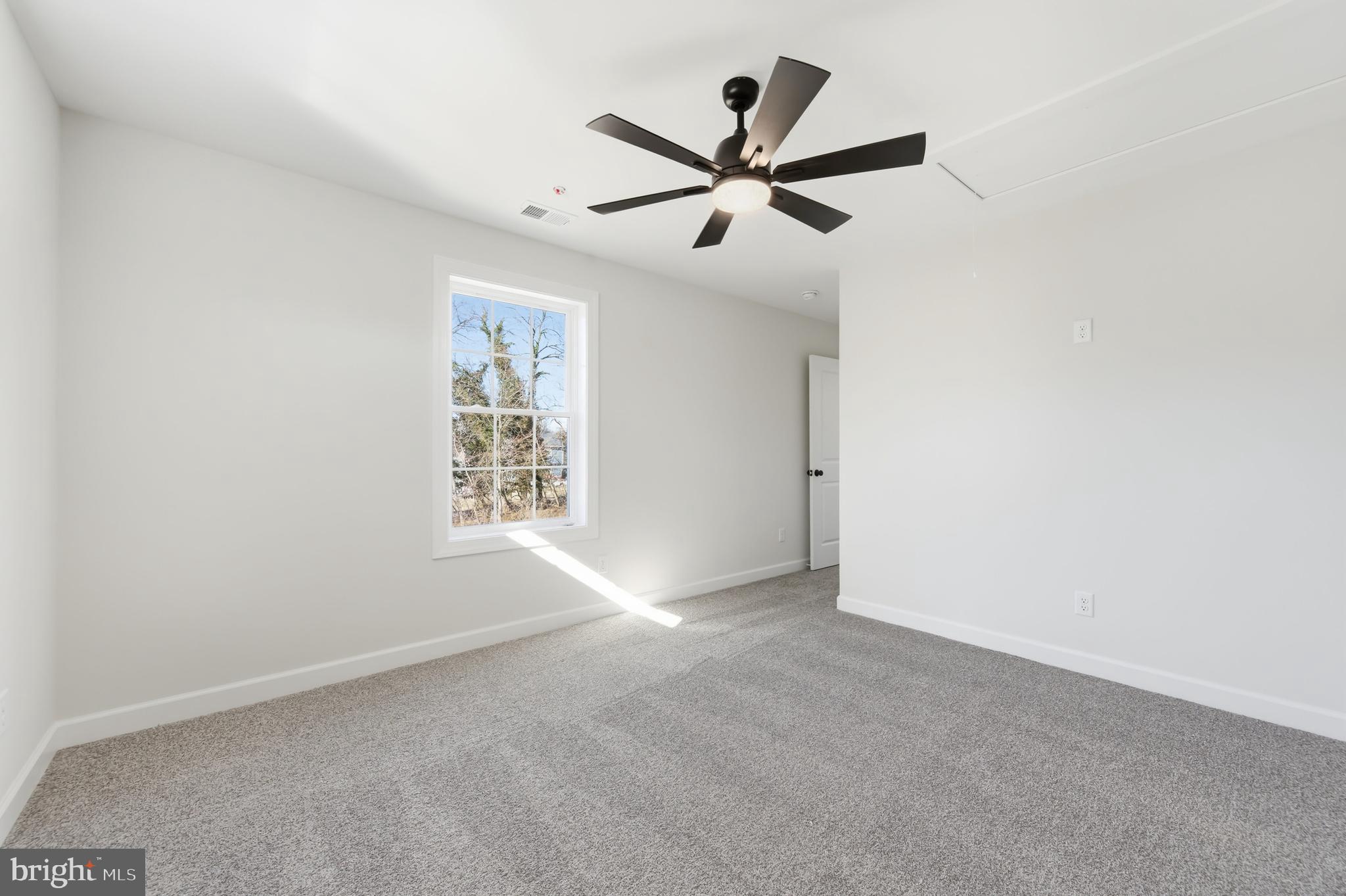 132 Spring Street Centreville, MD 21617 - Photo 12 of 19 a view of a big room with closet and windows