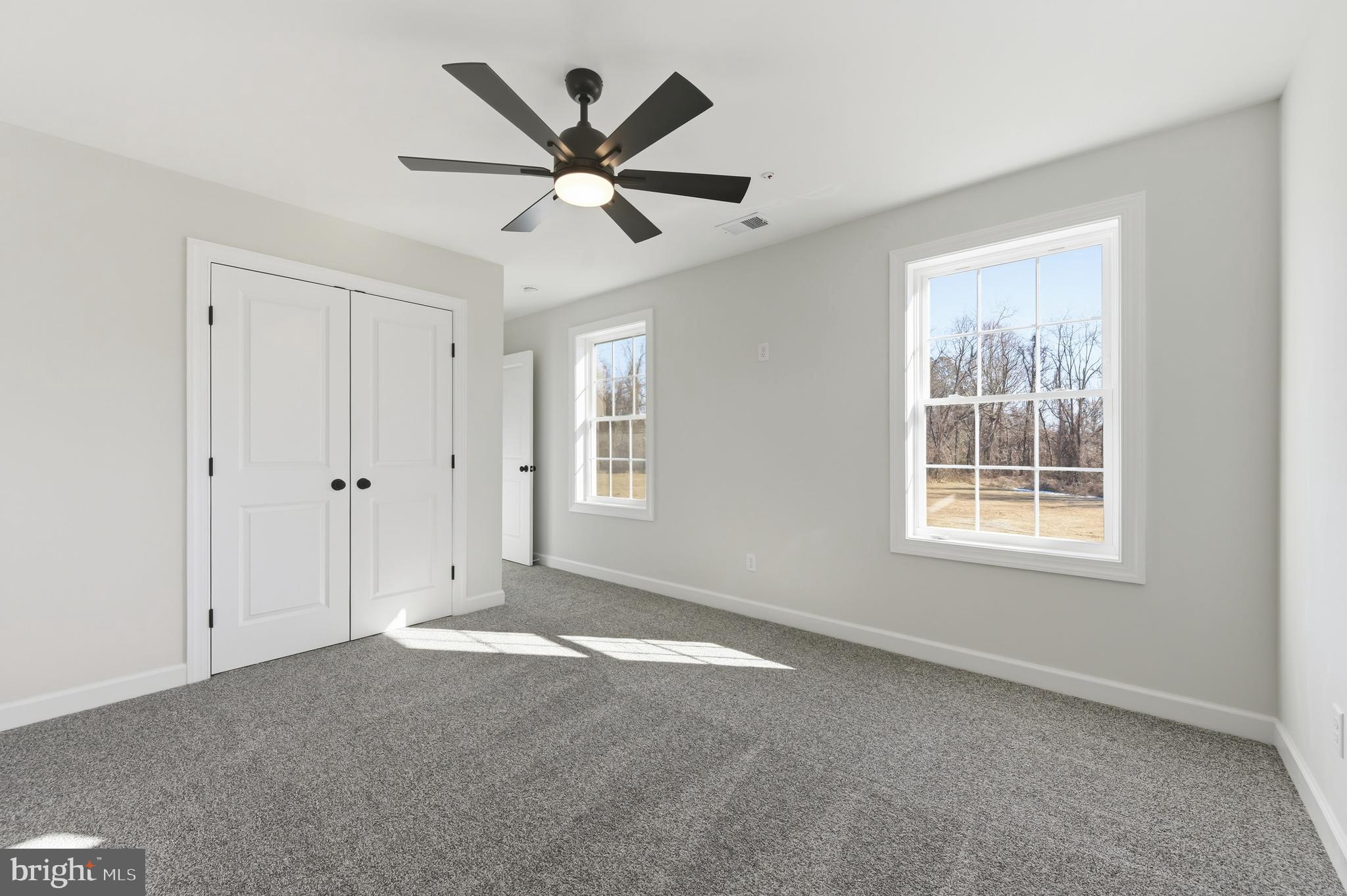 132 Spring Street Centreville, MD 21617 - Photo 14 of 19 a view of a big room with wooden floor and windows in a room