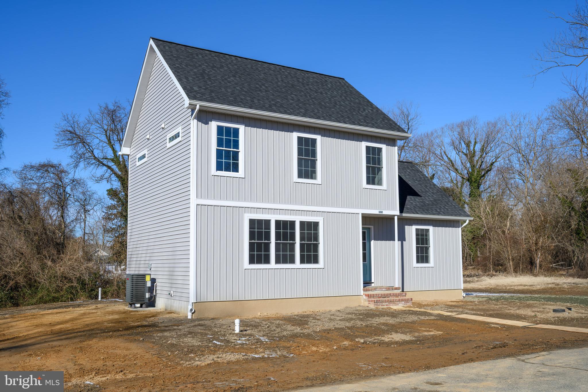 132 Spring Street Centreville, MD 21617 - Photo 2 of 19 a front view of a house with a yard