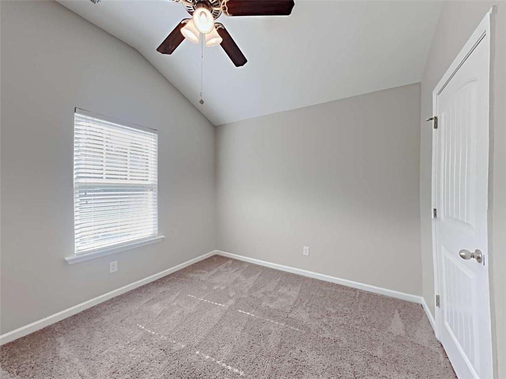 421 Reinhardt Lane Ball Ground, GA 30107 - Photo 15 of 22 a view of a livingroom with a ceiling fan and window