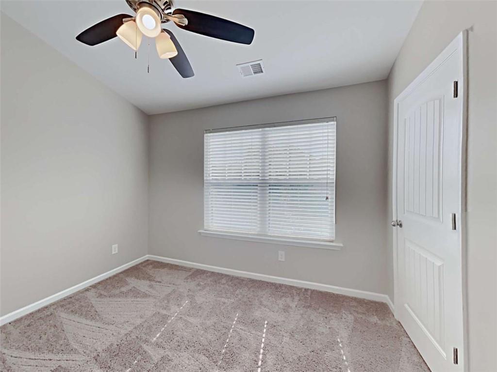 421 Reinhardt Lane Ball Ground, GA 30107 - Photo 16 of 22 a view of an empty room with a window