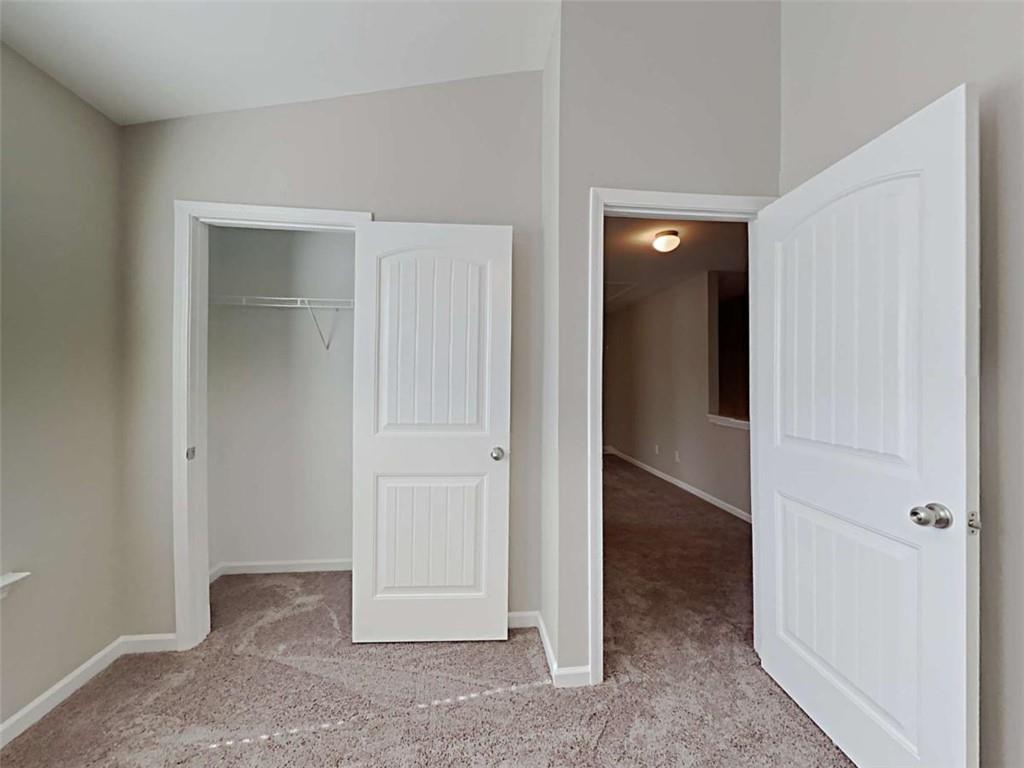 421 Reinhardt Lane Ball Ground, GA 30107 - Photo 17 of 22 wooden floor and closet in a room