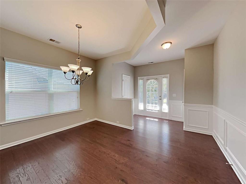 421 Reinhardt Lane Ball Ground, GA 30107 - Photo 9 of 22 a view of empty room with wooden floor and fan
