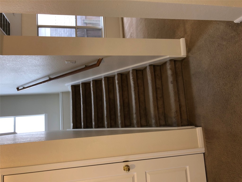 3604 Roller Crossing Austin, TX 78728 - Photo 17 of 40 Stairway with carpet and healthy amount of natural light