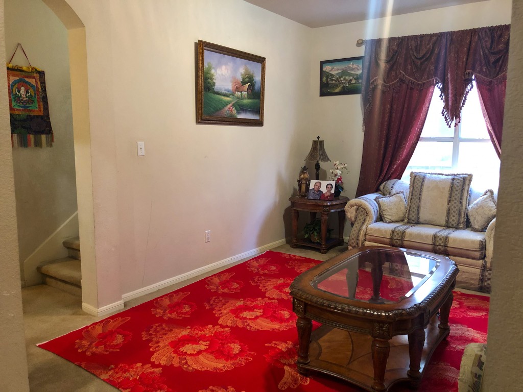 3604 Roller Crossing Austin, TX 78728 - Photo 3 of 40 Living room featuring stairway and arched walkways