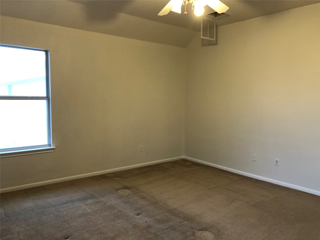 3604 Roller Crossing Austin, TX 78728 - Photo 31 of 40 Unfurnished room featuring ceiling fan and dark colored carpet