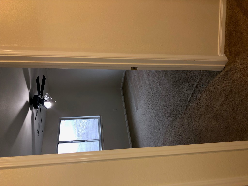 3604 Roller Crossing Austin, TX 78728 - Photo 37 of 40 Unfurnished room featuring dark colored carpet and a ceiling fan