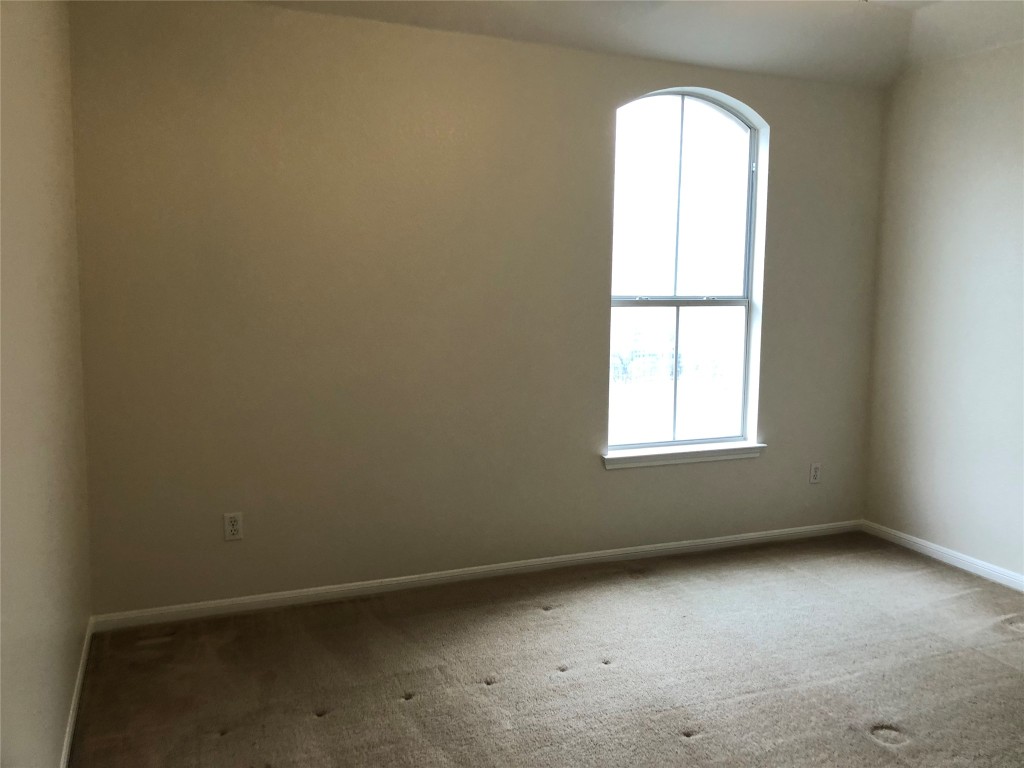 3604 Roller Crossing Austin, TX 78728 - Photo 40 of 40 Carpeted spare room with baseboards