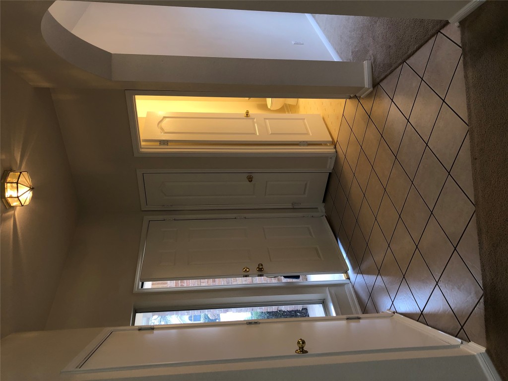 3604 Roller Crossing Austin, TX 78728 - Photo 9 of 40 Entryway with light tile patterned floors and arched walkways