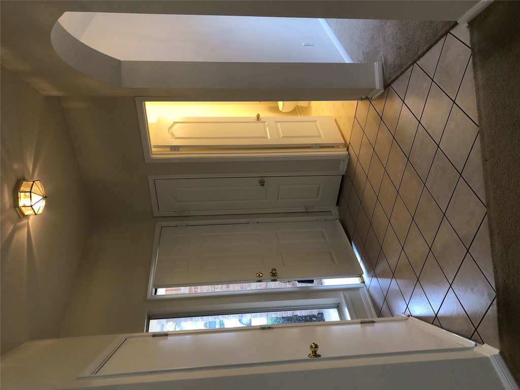 3604 Roller Crossing Austin, TX 78728 - Photo 10 of 40 Foyer entrance featuring light tile patterned flooring and arched walkways