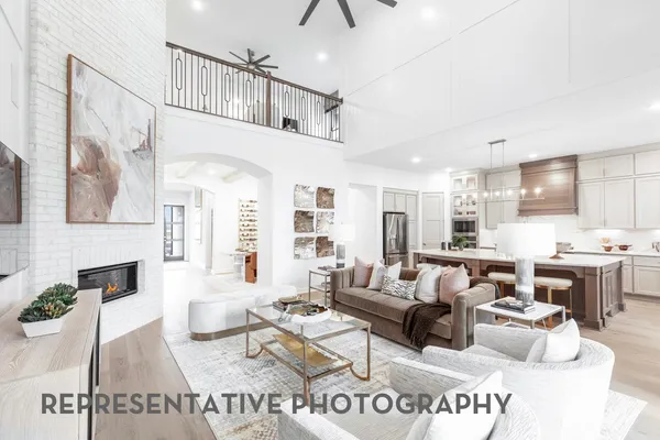 a living room with furniture or kitchen view and a fireplace