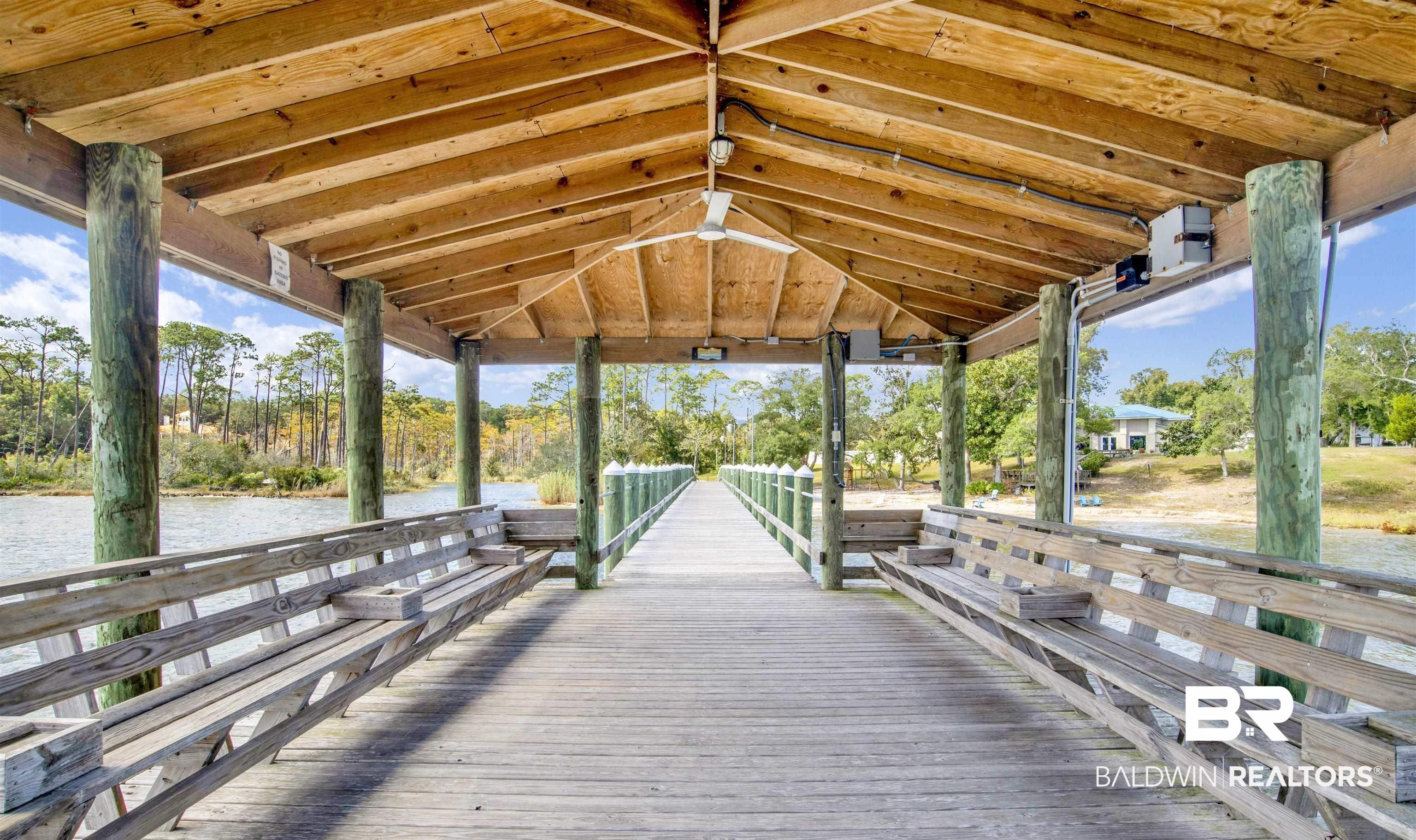 683 Escambia Loop Lillian, AL 36549 - Photo 23 of 27 View of dock with a gazebo