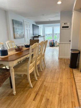 a view of a dining room with furniture and a wooden floor