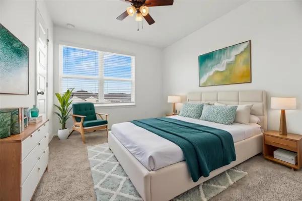 a bedroom with a bed and a couch