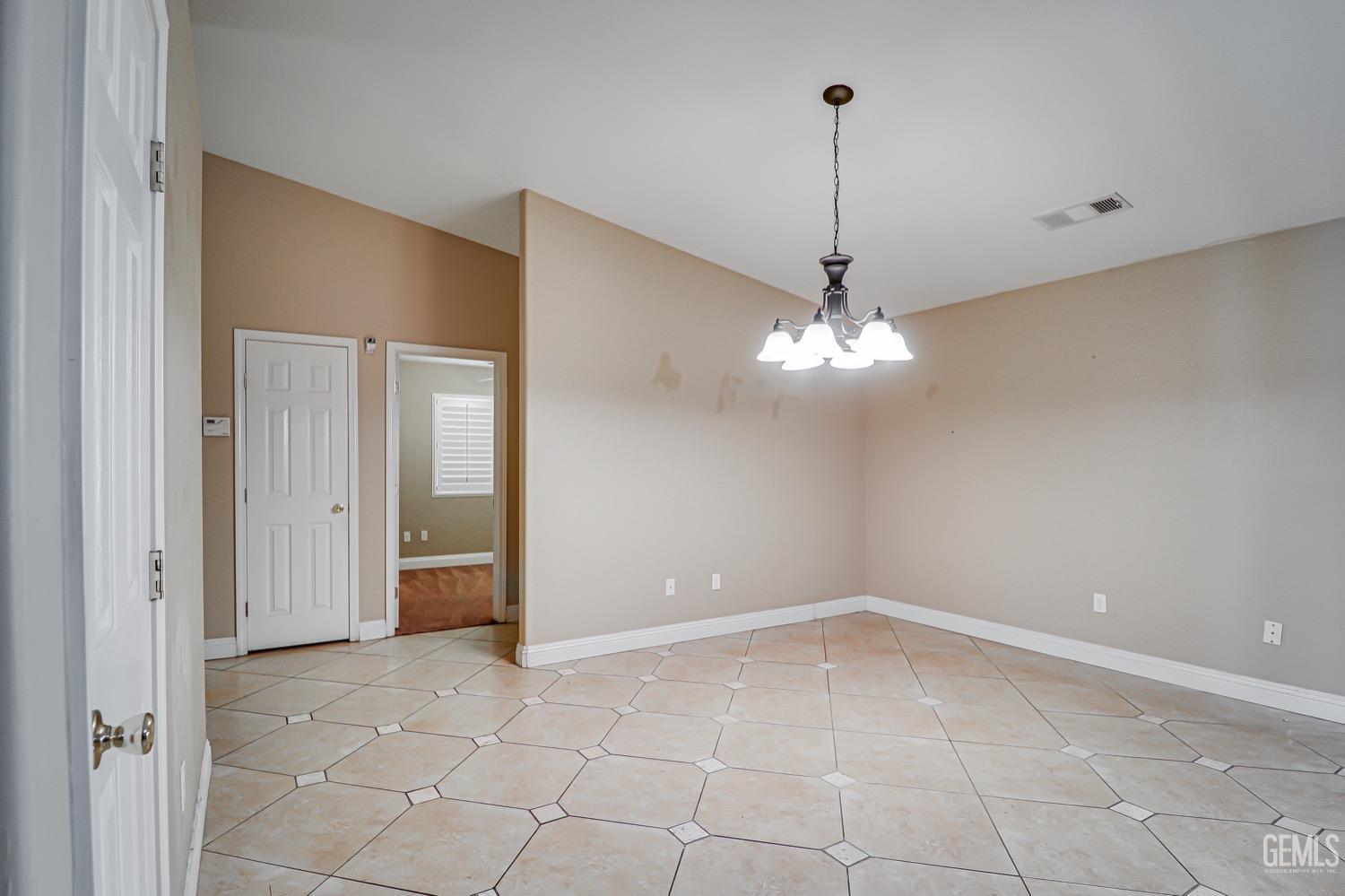 Undisclosed Address Bakersfield, CA 93312 - Photo 12 of 28 a view of a chandelier fan and entryway