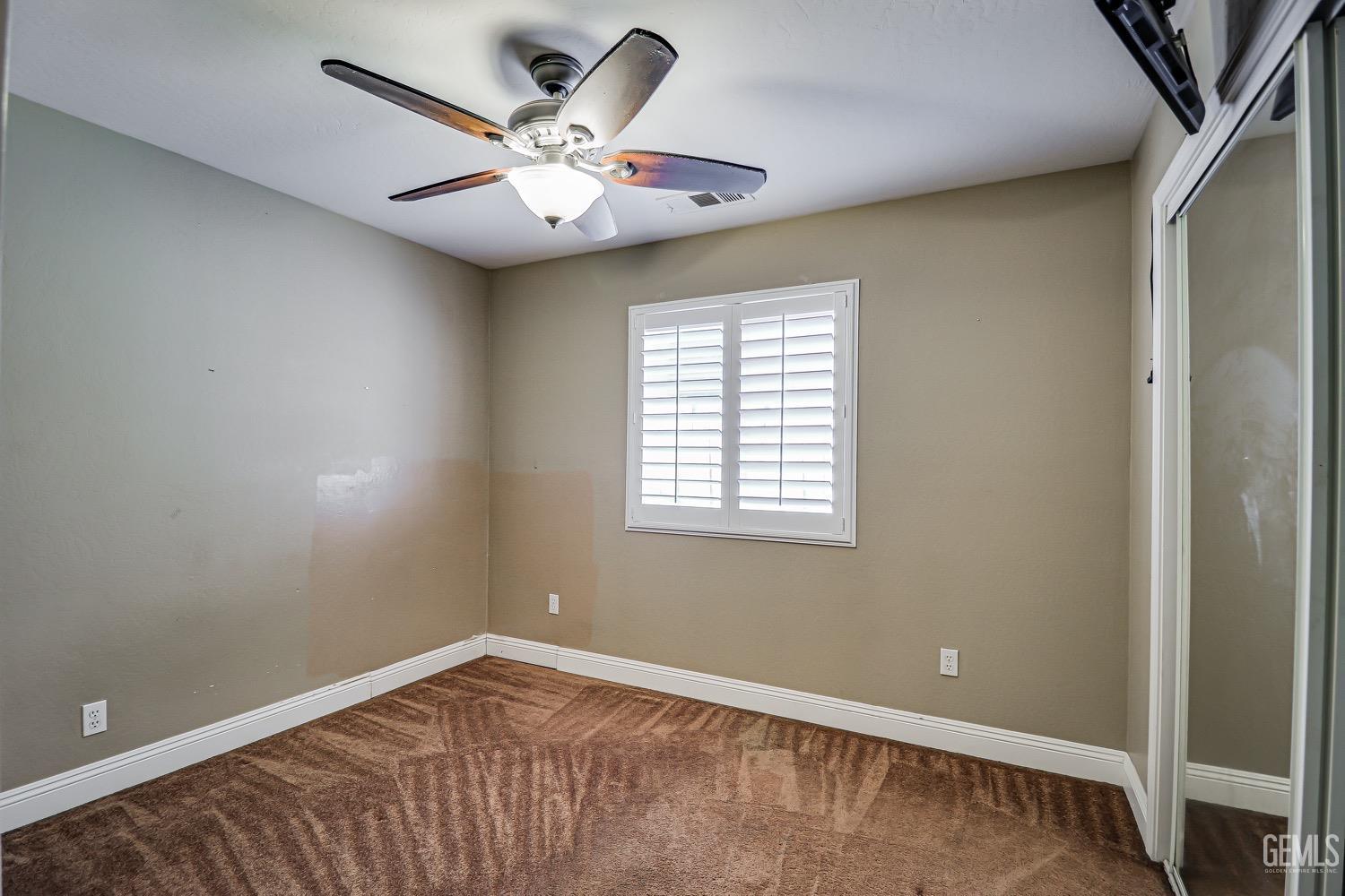 Undisclosed Address Bakersfield, CA 93312 - Photo 14 of 28 an empty room with a window