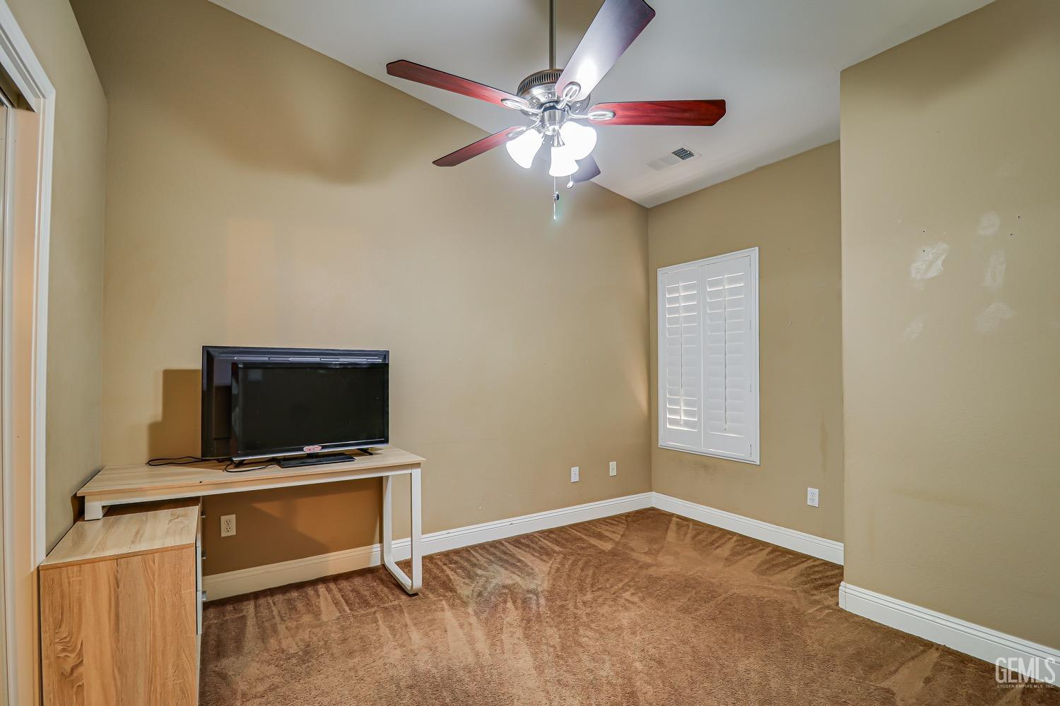 Undisclosed Address Bakersfield, CA 93312 - Photo 15 of 28 a view of room with flat screen tv and ceiling fan