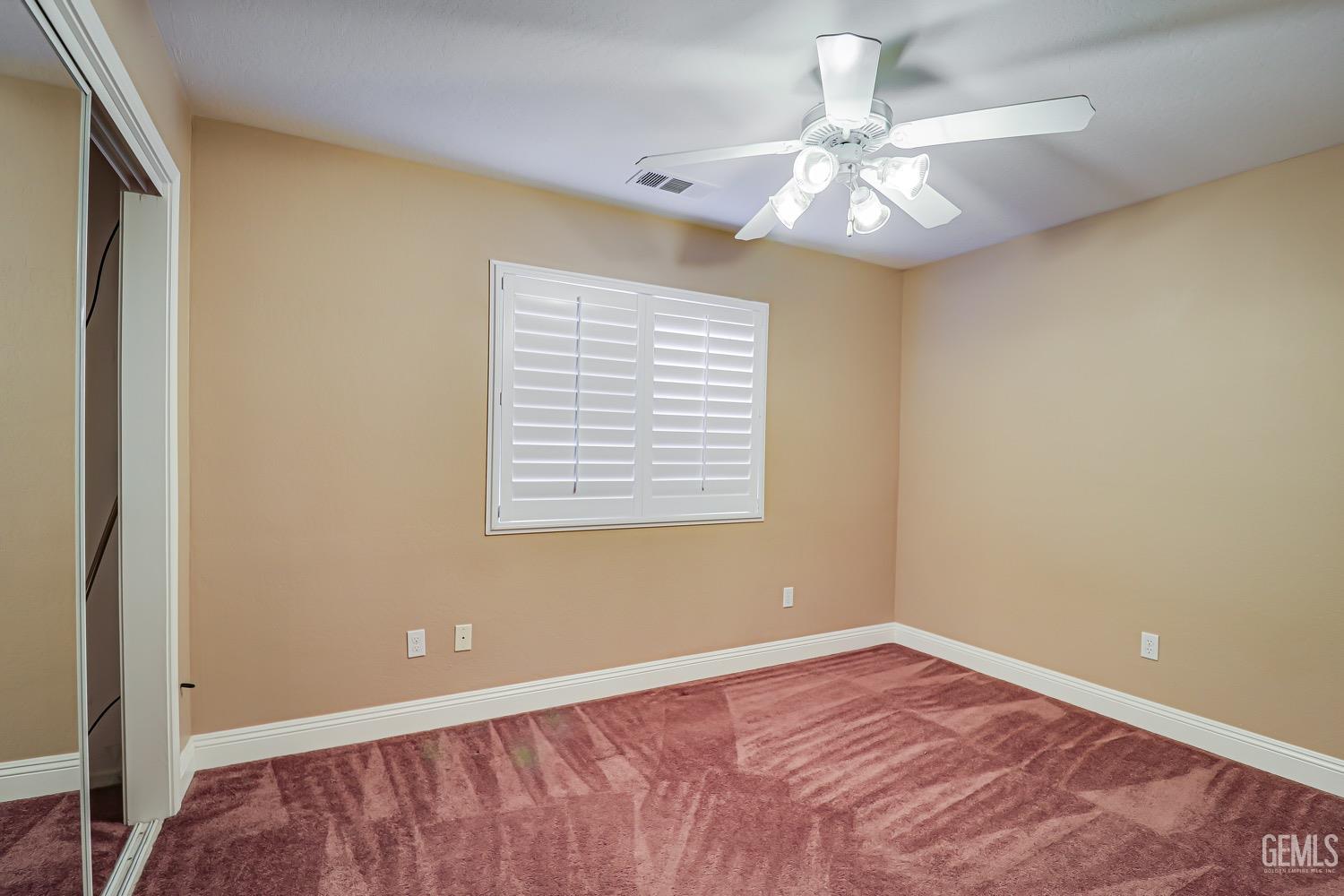 Undisclosed Address Bakersfield, CA 93312 - Photo 17 of 28 a view of an empty room with a window