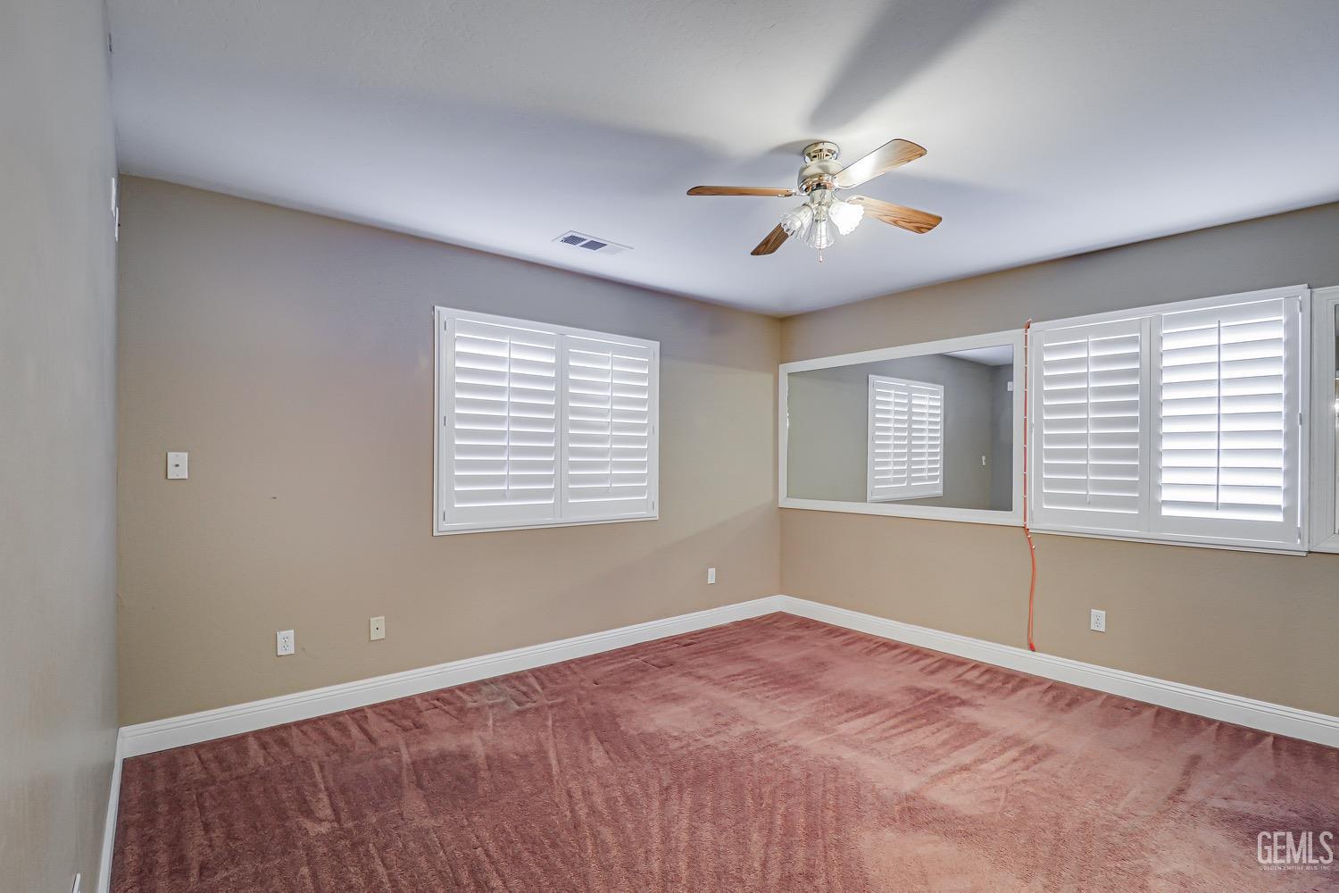 Undisclosed Address Bakersfield, CA 93312 - Photo 18 of 28 a view of an empty room with a window