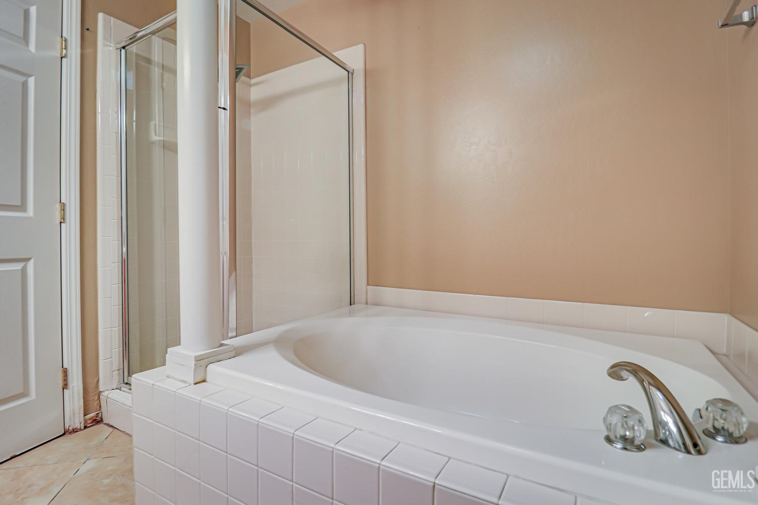 Undisclosed Address Bakersfield, CA 93312 - Photo 21 of 28 a bathroom with a white tub