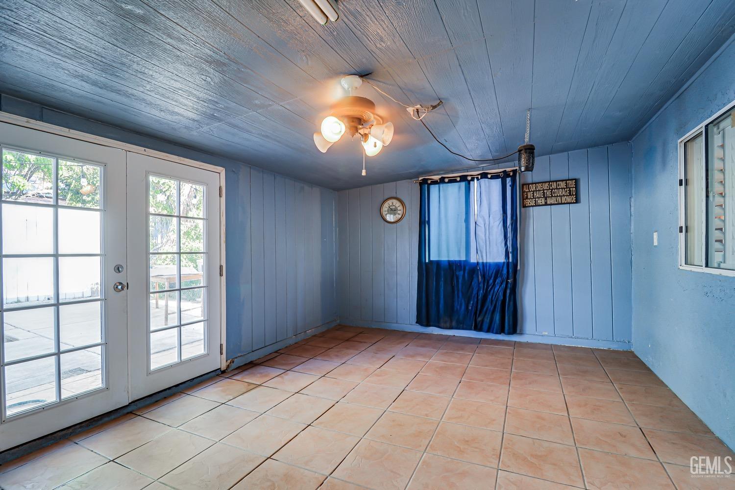 Undisclosed Address Bakersfield, CA 93312 - Photo 23 of 28 a view of an empty room with window and chandelier fan