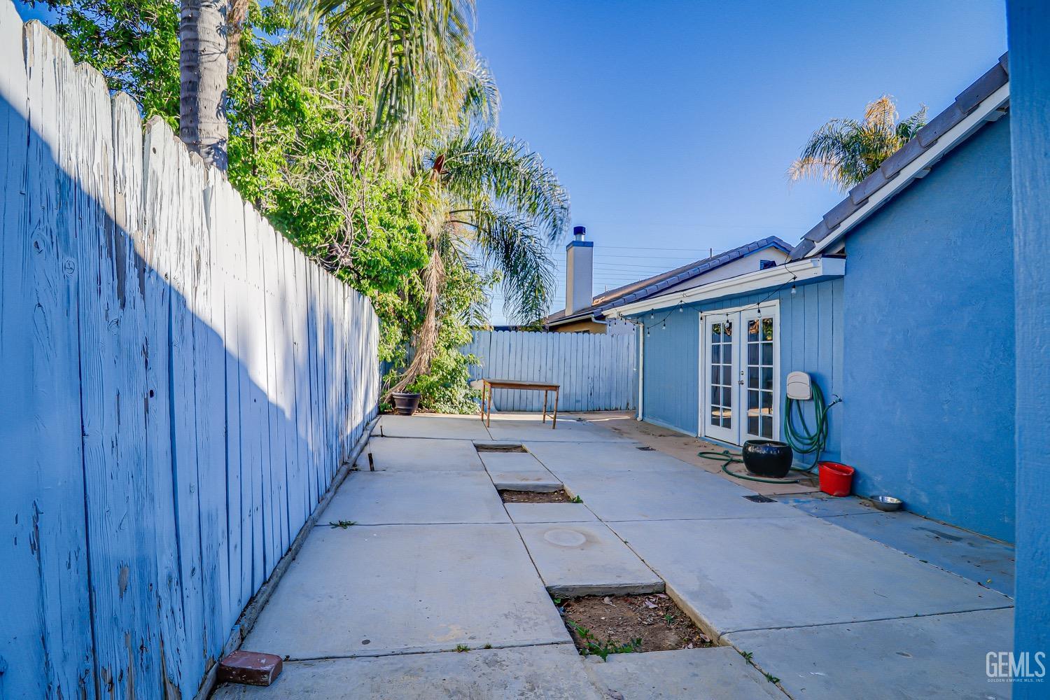 Undisclosed Address Bakersfield, CA 93312 - Photo 26 of 28 a view of a house with a backyard and wooden fence