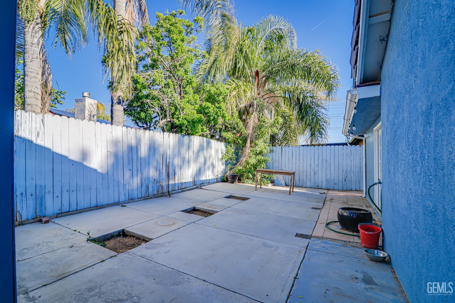 Undisclosed Address Bakersfield, CA 93312 - Photo 27 of 28 a backyard of a house with seating space and trees