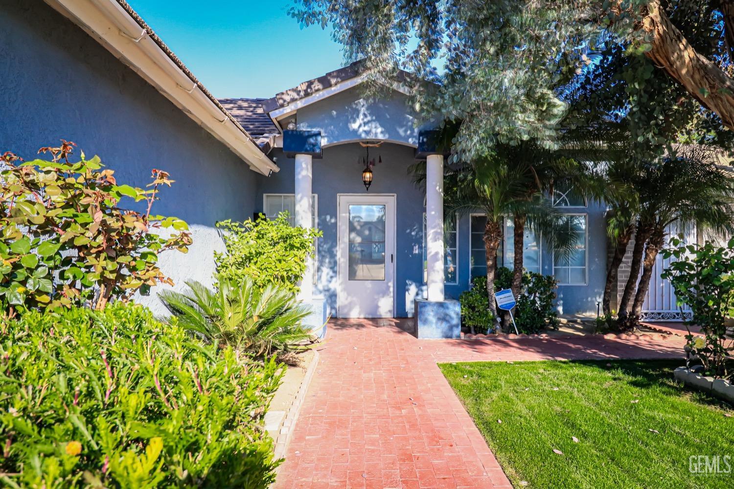 Undisclosed Address Bakersfield, CA 93312 - Photo 4 of 28 a front view of a house with a yard