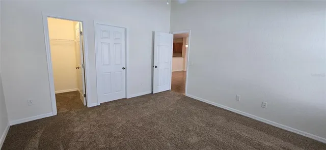 a view of an empty room and a window