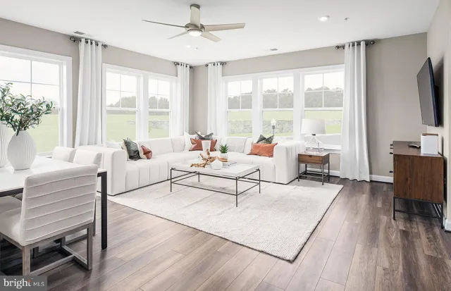 a view of a dining room with furniture window and wooden floor