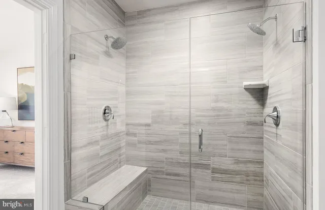 a bathroom with a granite countertop sink a mirror and a