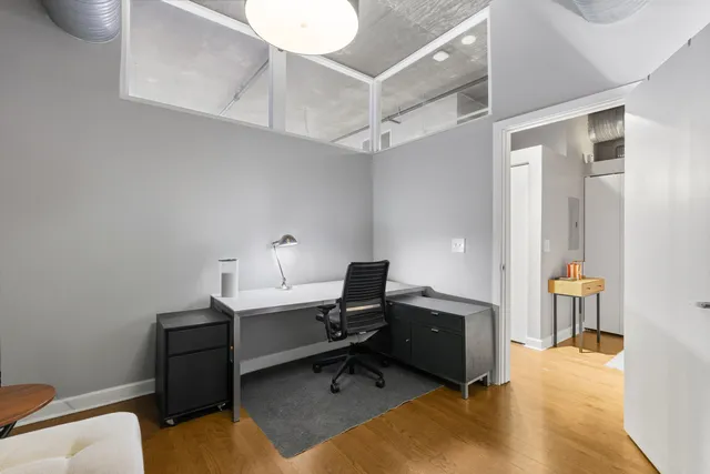 a view of a workspace with furniture