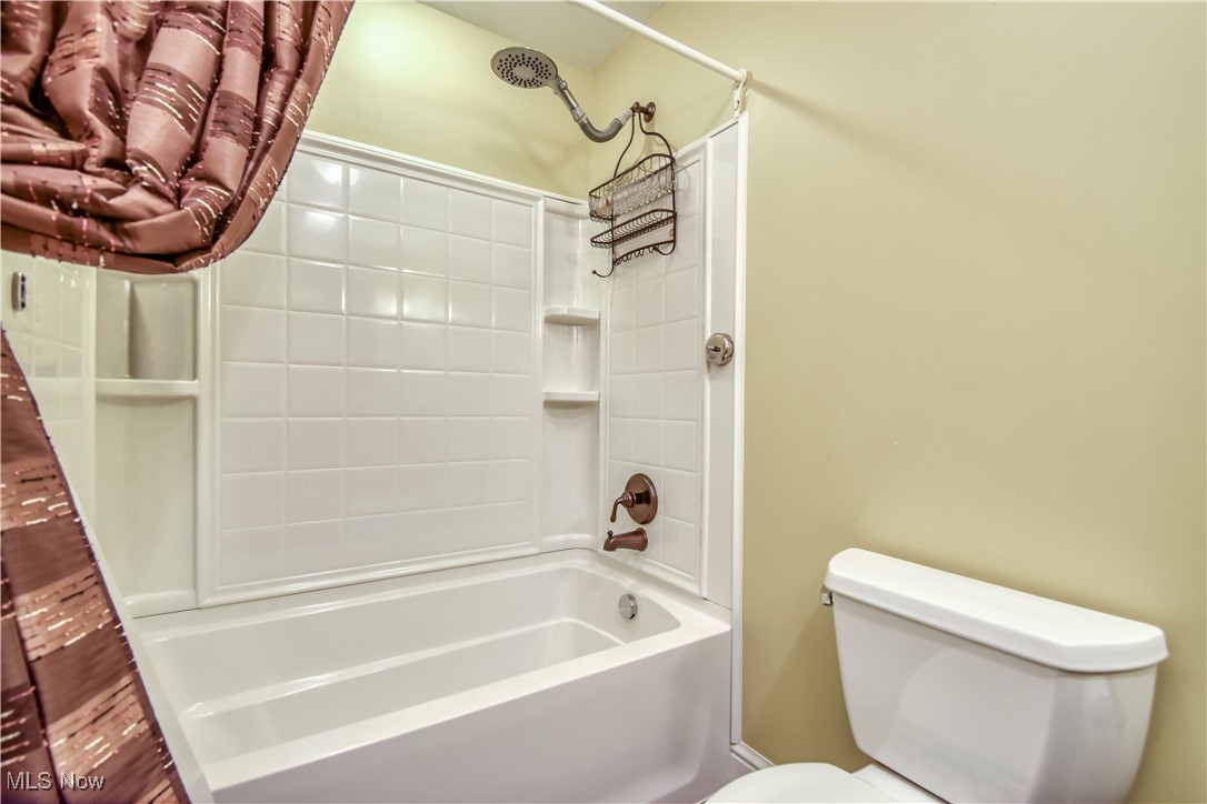 9715 Johnnycake Ridge Road Mentor, OH 44060 - Photo 7 of 50 Full bathroom featuring toilet and bathtub / shower combination